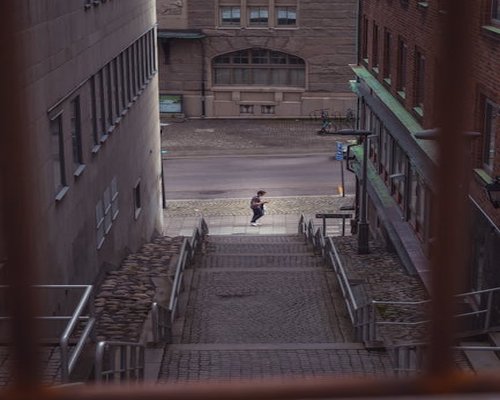 Person taking the stairs instead of using the elevator in a residential building